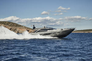 Pershing 9X cruising at full speed along the coastline of Ibiza